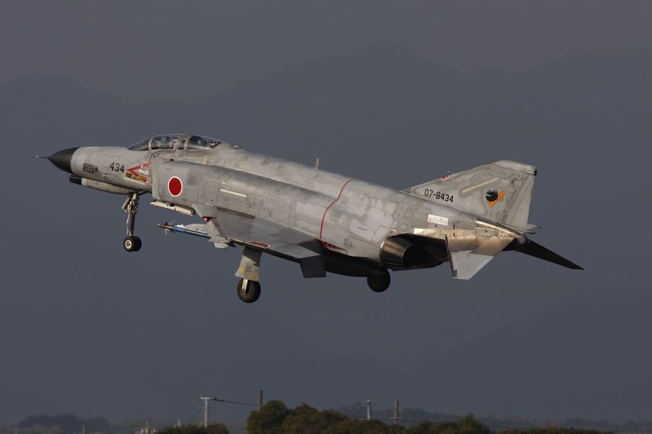 F4EJ Kai of 301 Hikotai landing back at Nyutubaru AB after a thunderstorm on December 5th 2011. The aircraft is in standard air to air configuration of centreline tank and short range AAM 3 drill rounds.  Photo © D. Draycott