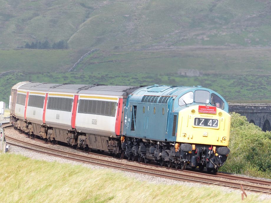 Last summer there was a programme of special trains shuttling several times a day between Skipton and Appleby under the name of The Staycation Express.  A variety of heritage diesels were utilised, including the Class 40 Preservation Society 40 145, seen here coming off Ribblehead Viaduct with the 1039 Appleby to Skipton service on the 12th September 2020. Copyright Geoff Cooper-Smith